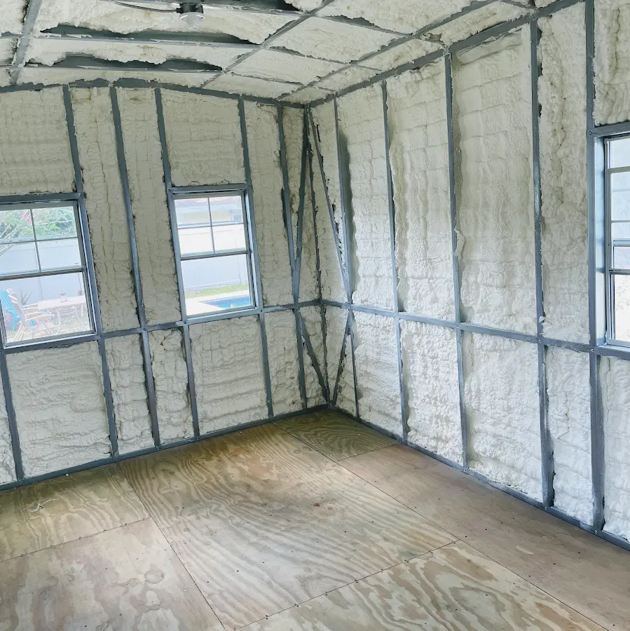 Closed-cell spray foam insulation applied to wall cavities in a residential project in Demopolis